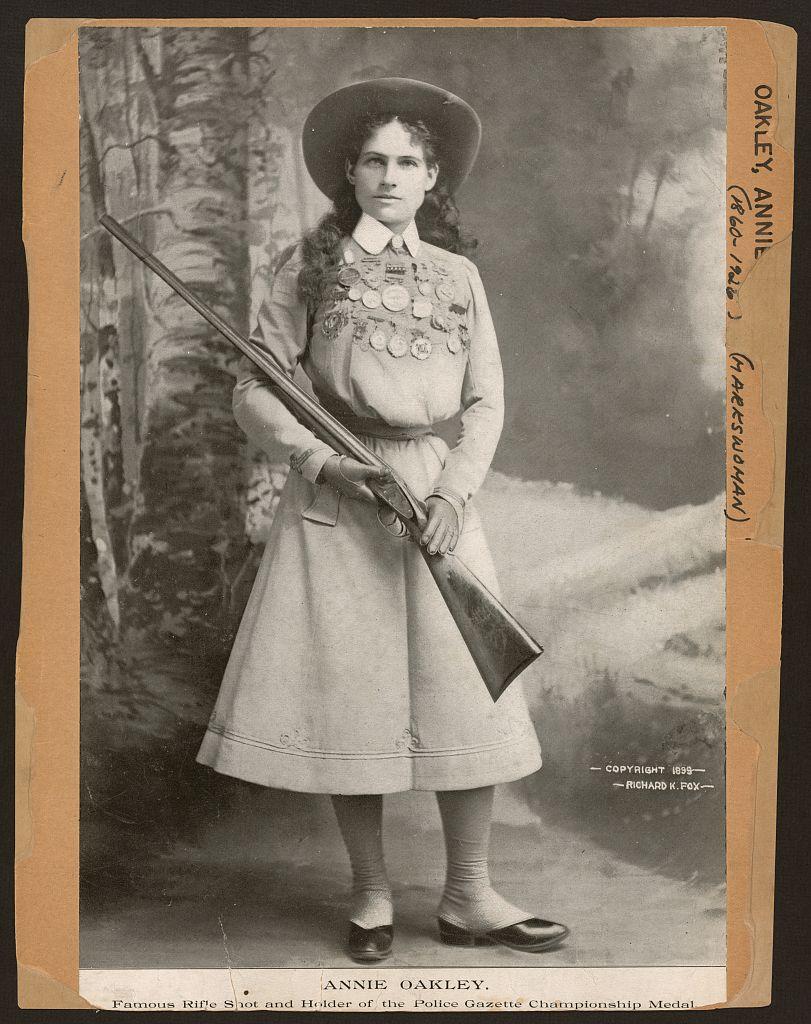 Annie Oakley - famous rifle shot and holder of the Police Gazette championship medal Annie Oakley - famous rifle shot and holder of the Police Gazette championship medal