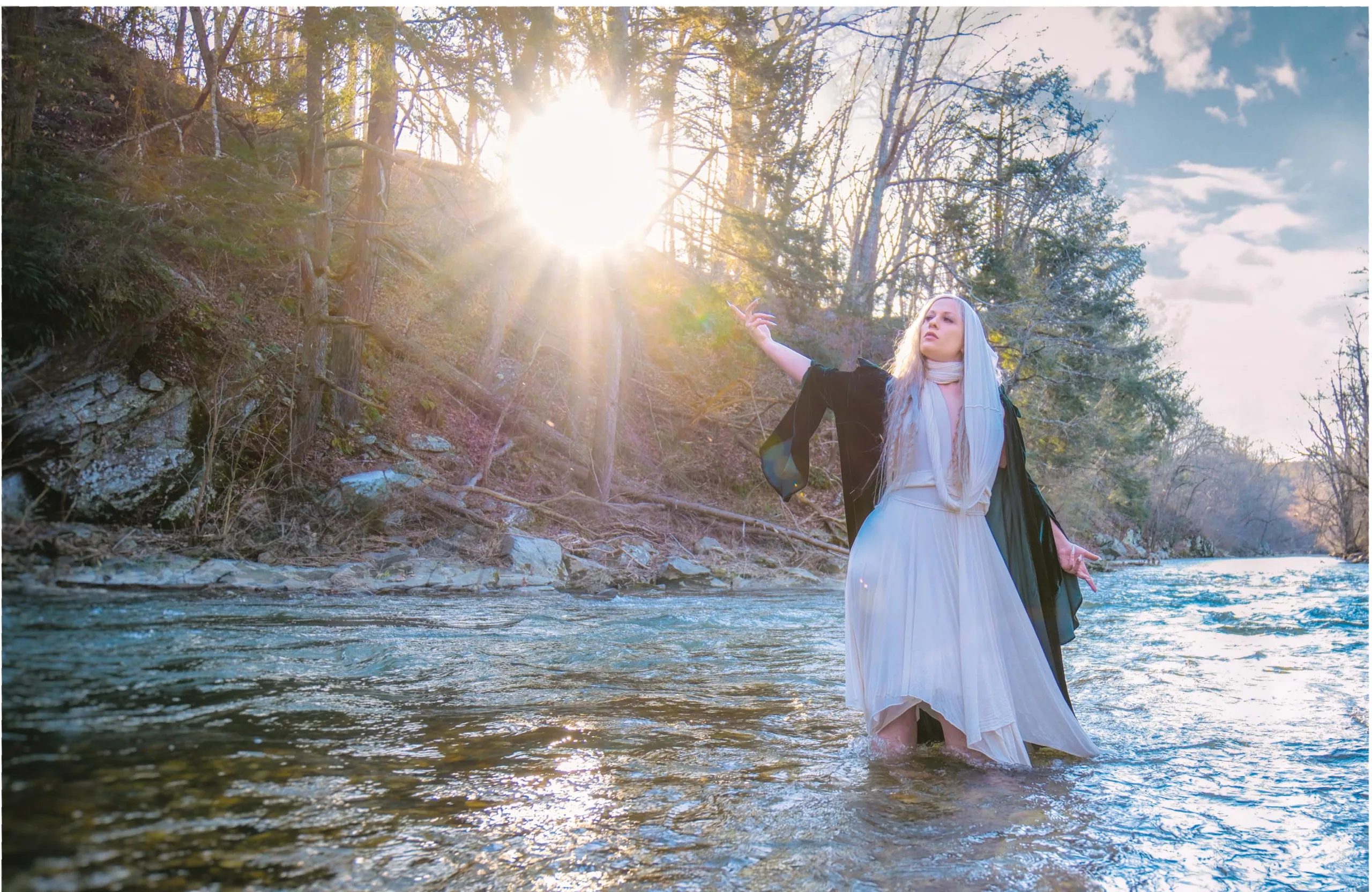 Rachael Platt_By_steve_parke_04 Winter Enchantment: Ceramicist Rachael Platt holding a lit manifesting jar under the full moon, surrounded by illuminated jars in a forest setting. Photography by steve parke